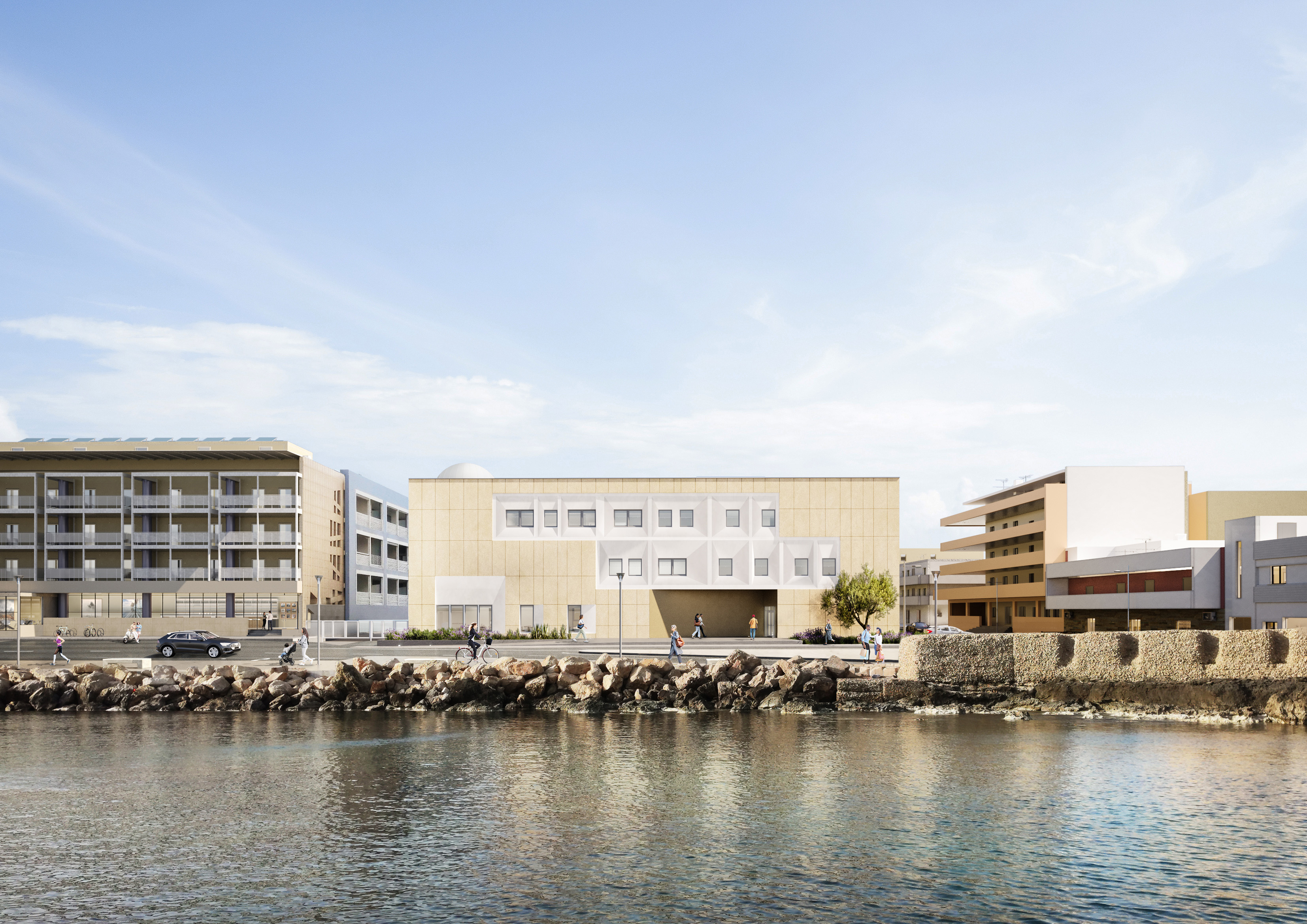 O projeto integra pedra local, acesso em terraço e formas dinâmicas para criar espaços educativos e comunitários flexíveis